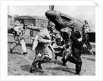 Fighter pilots run to their planes by Associated Newspapers