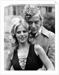 Michael Caine with Britt Ekland by Associated Newspapers