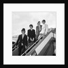 The Beatles on the steps of a plane by Associated Newspapers