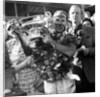 Sir Stirling Moss, racing driver after winning his first British Grand Prix in 1955 by Associated Newspapers