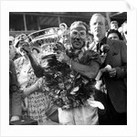 Sir Stirling Moss, racing driver after winning his first British Grand Prix in 1955 by Associated Newspapers