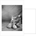 WAAF checking barrage balloon by Associated Newspapers