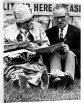 Racegoers relaxing by Associated Newspapers