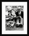 Racegoers relaxing by Associated Newspapers