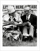 Racegoers relaxing by Associated Newspapers