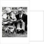 Racegoers relaxing by Associated Newspapers