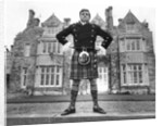Oliver Reed in kilt by Associated Newspapers