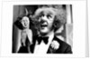 Ken Dodd on stage by Associated Newspapers
