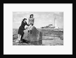 On the beach by the lighthouse at Whitley Bay by Associated Newspapers