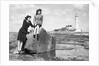 On the beach by the lighthouse at Whitley Bay by Associated Newspapers