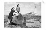 On the beach by the lighthouse at Whitley Bay by Associated Newspapers