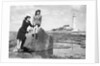 On the beach by the lighthouse at Whitley Bay by Associated Newspapers