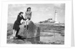 On the beach by the lighthouse at Whitley Bay by Associated Newspapers