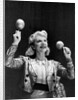 Dance band leader with maracas by Associated Newspapers