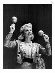Dance band leader with maracas by Associated Newspapers