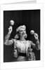 Dance band leader with maracas by Associated Newspapers
