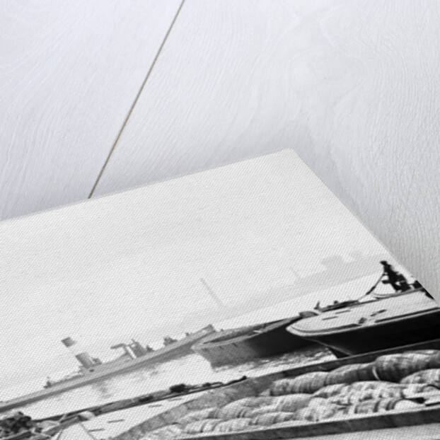 Steam tug moving between barges on the Thames, London by Anonymous