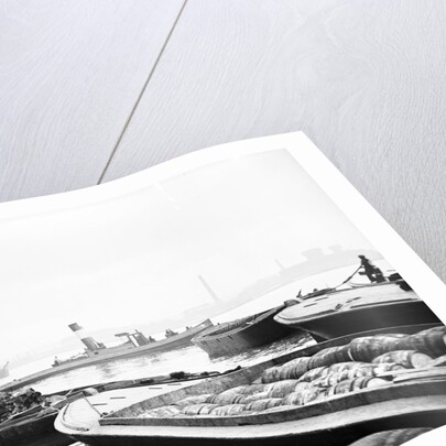Steam tug moving between barges on the Thames, London by Anonymous