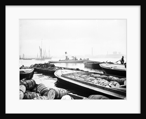 Steam tug moving between barges on the Thames, London by Anonymous