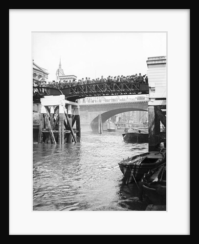 Passengers for the river bus service on the footbridge to London Bridge Pier, London by Anonymous