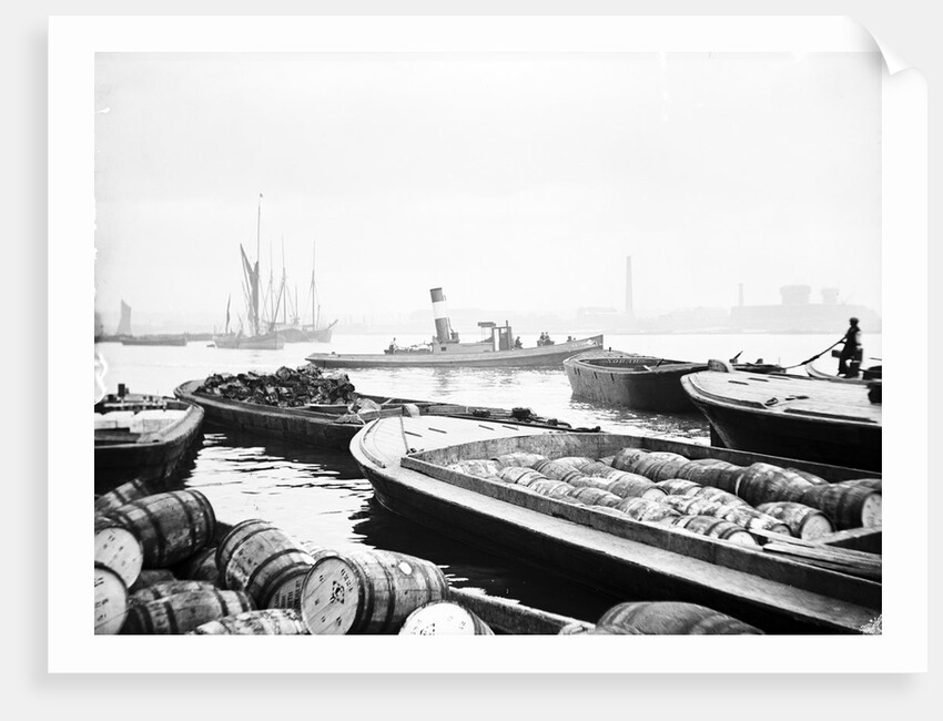 Steam tug moving between barges on the Thames, London by Anonymous