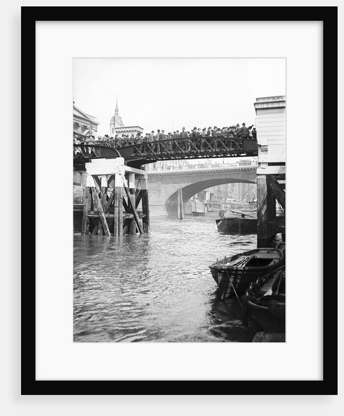 Passengers for the river bus service on the footbridge to London Bridge Pier, London by Anonymous