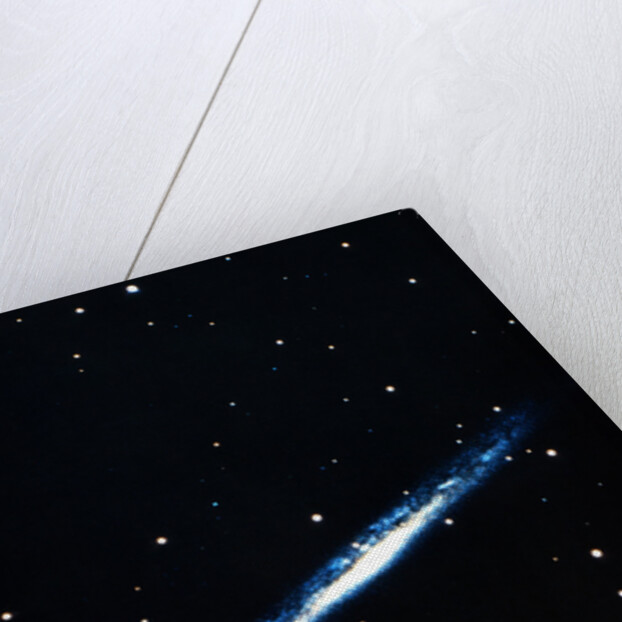 Spiral galaxy viewed edge on by Unknown