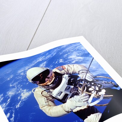 US Astronaut Edward H. White II carrying out external tasks by Unknown