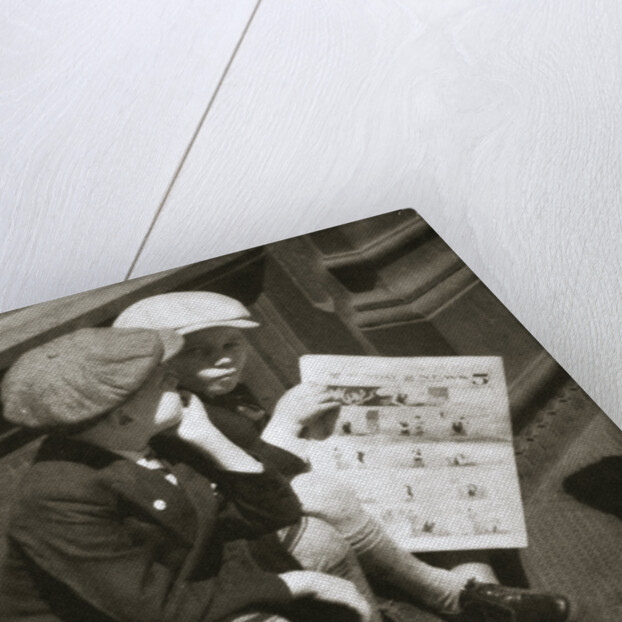 Two boys reading the comic section of the Sunday paper, New York, USA, 1931 by Unknown