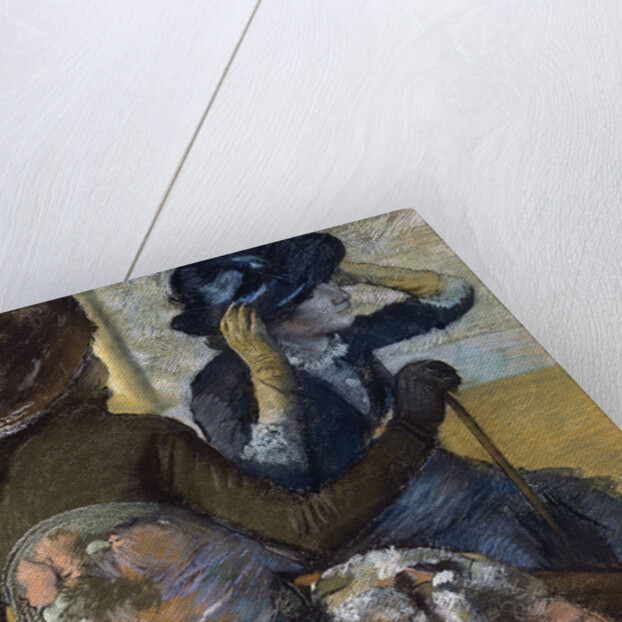 At the Milliner's by Edgar Degas