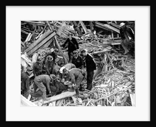 Rescue workers releasing a man from a bomb damaged building, World War II, 1940 by Unknown