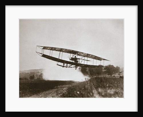 American aviator Glenn Curtiss making the first heavier-than-air flight in his June Bug, 1908 by Edwin Levick