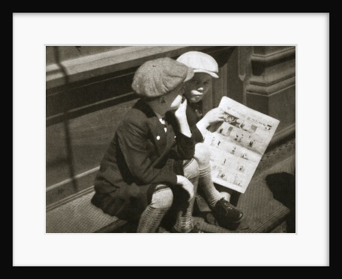 Two boys reading the comic section of the Sunday paper, New York, USA, 1931 by Unknown