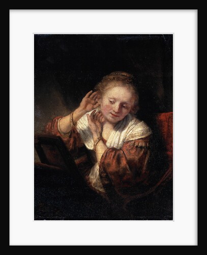 Young Woman trying on Earrings, 1657. by Rembrandt Harmensz van Rijn