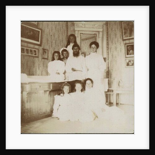 Grigory Rasputin with Empress Alexandra Fyodorovna, her five children and seated right governess Mar by Anonymous