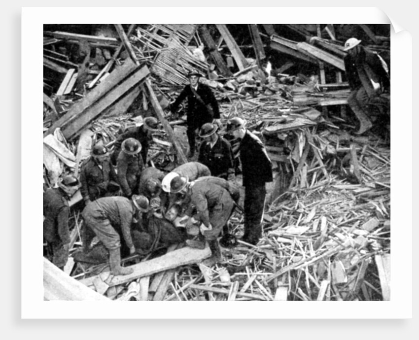 Rescue workers releasing a man from a bomb damaged building, World War II, 1940 by Unknown