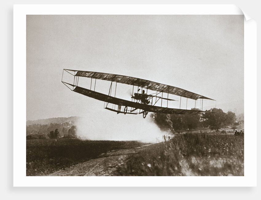 American aviator Glenn Curtiss making the first heavier-than-air flight in his June Bug, 1908 by Edwin Levick