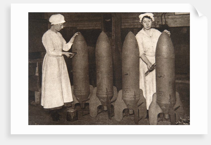 Women munitions workers putting a coat of paint on aerial bombs, World War I, c1914-c1918 by S and G