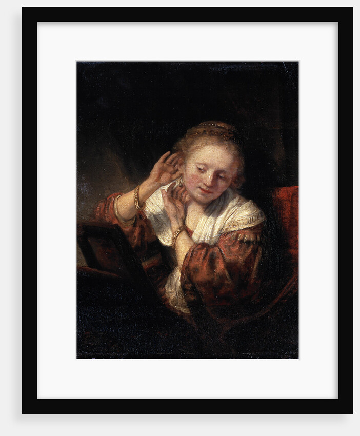 Young Woman trying on Earrings, 1657. by Rembrandt Harmensz van Rijn