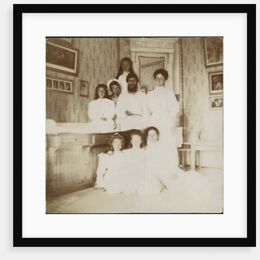 Grigory Rasputin with Empress Alexandra Fyodorovna, her five children and seated right governess Mar by Anonymous