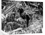 Rescue workers releasing a man from a bomb damaged building, World War II, 1940 by Unknown