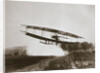 American aviator Glenn Curtiss making the first heavier-than-air flight in his June Bug, 1908 by Edwin Levick