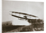 American aviator Glenn Curtiss making the first heavier-than-air flight in his June Bug, 1908 by Edwin Levick