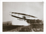 American aviator Glenn Curtiss making the first heavier-than-air flight in his June Bug, 1908 by Edwin Levick
