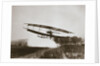 American aviator Glenn Curtiss making the first heavier-than-air flight in his June Bug, 1908 by Edwin Levick