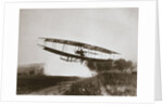 American aviator Glenn Curtiss making the first heavier-than-air flight in his June Bug, 1908 by Edwin Levick