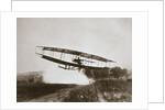 American aviator Glenn Curtiss making the first heavier-than-air flight in his June Bug, 1908 by Edwin Levick