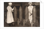 Women munitions workers putting a coat of paint on aerial bombs, World War I, c1914-c1918 by S and G