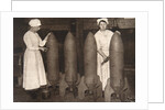 Women munitions workers putting a coat of paint on aerial bombs, World War I, c1914-c1918 by S and G