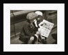 Two boys reading the comic section of the Sunday paper, New York, USA, 1931 by Unknown